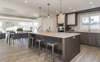 An exquisite kitchen extension by G&M Building Contractors. The modern look with an island, hanging lights and wooden floor is typical of the extension building work that they provide to the Oxfordshire and Berkshire areas. This project was close to Oxford, Swindon, Newbury and Reading.